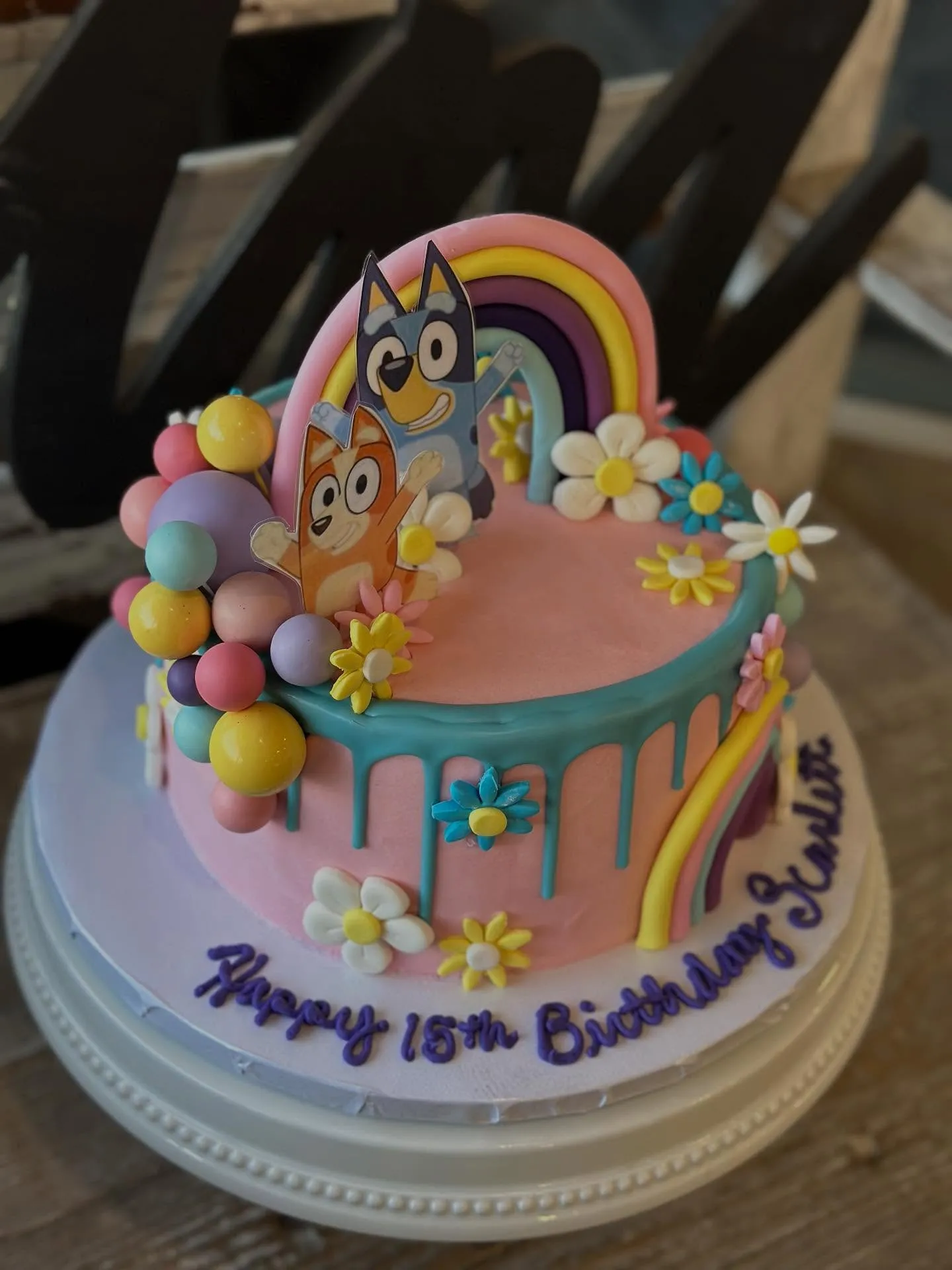 Colorful birthday cake with creative decorations, modern design, professional bakery photography